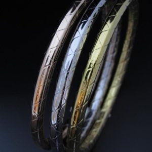 BRAZALETE RIGIDO ACERO 3 OROS